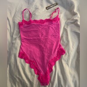 Skims XS body suit.